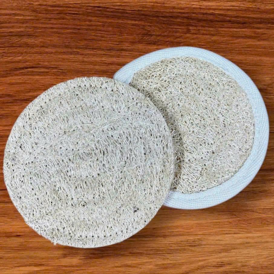 Wholesale natural loofah drink coasters in raw edge and bordered designs for eco-friendly table protection.
