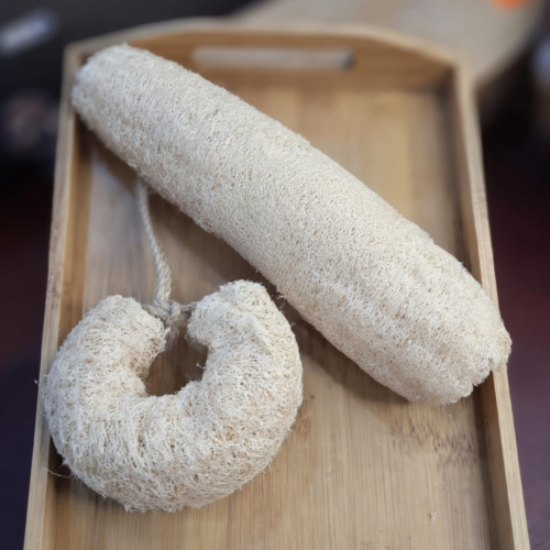 Premium wholesale whole loofah bathing sponge in natural uncut form for bulk export.